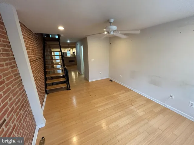 wooden floor in an empty room with a mirror