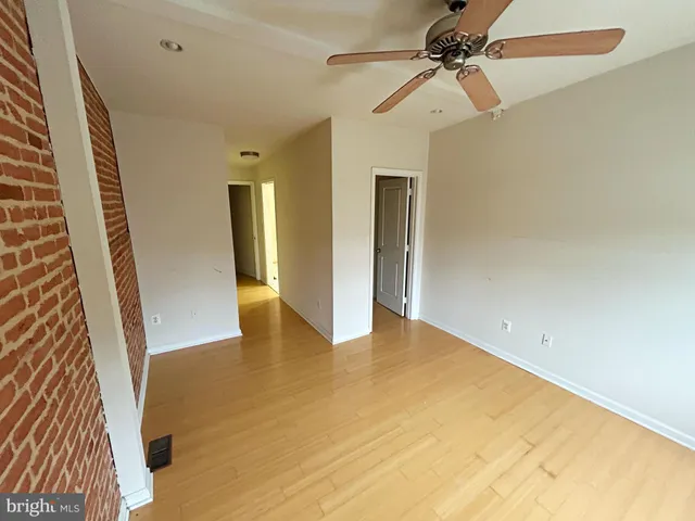 a view of an empty room with a bathroom