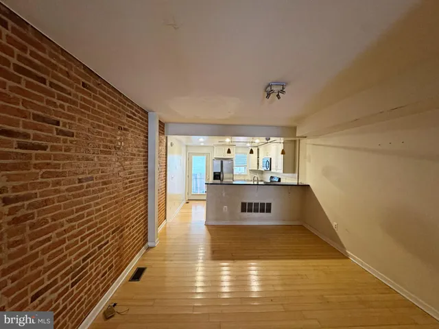 a view of kitchen with wooden floor