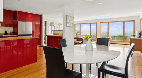 a view of a dining room with furniture window and outside view