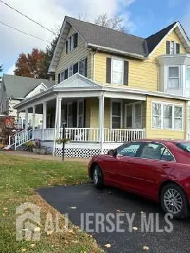a front view of a house with swimming pool