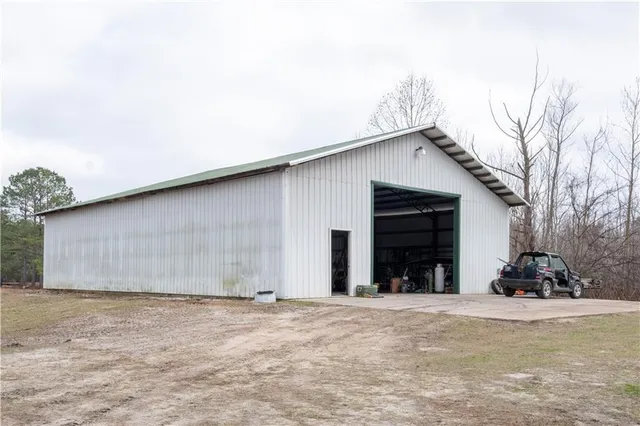 a view of a house with a yard and garage