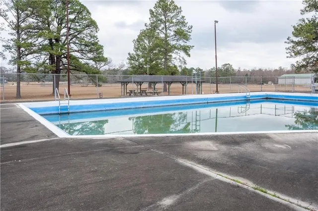 a view of a swimming pool with a patio