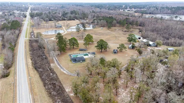 an aerial view of residential houses with outdoor space