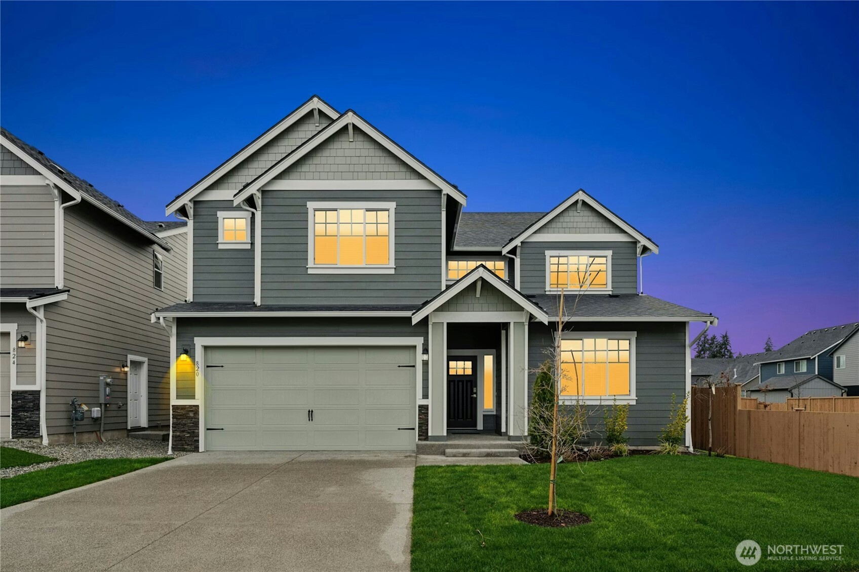 30315 11th Place South Federal Way, WA 98003 - Photo 1 of 1 a front view of a house with a yard and garage