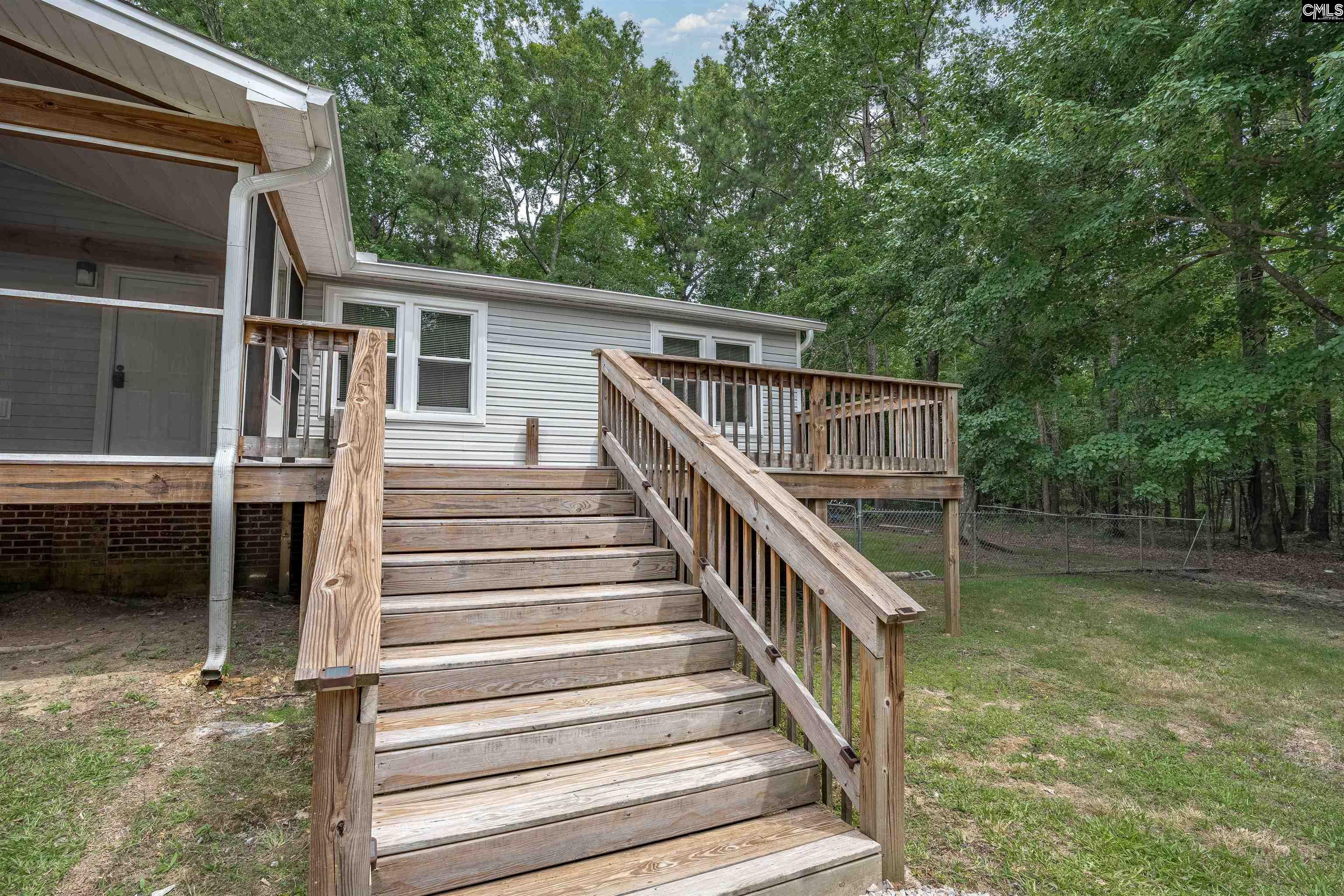 304 Cooper Road Blythewood, SC 29016 - Photo 3 of 29 a view of house with deck and outdoor seating