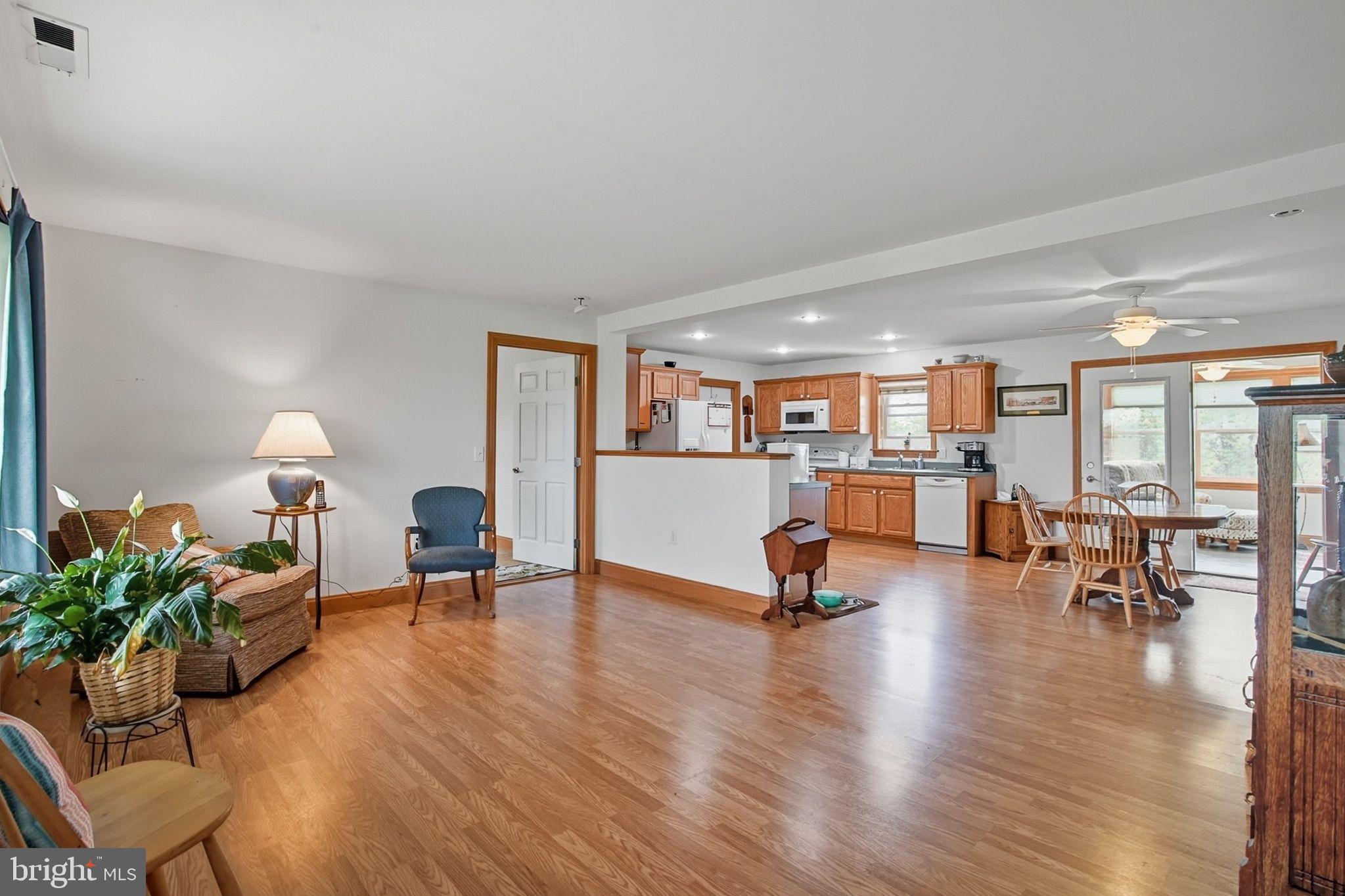 5304 Cassons Neck Road Cambridge, MD 21613 - Photo 13 of 46 a living room with furniture and a wooden floor
