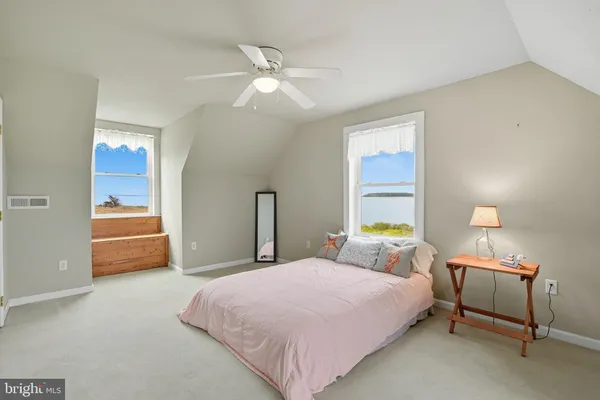 a bedroom with furniture and a chandelier