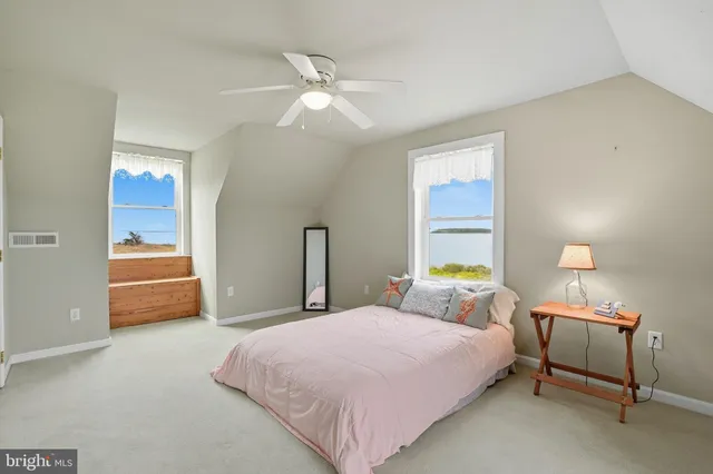 a bedroom with furniture and a chandelier