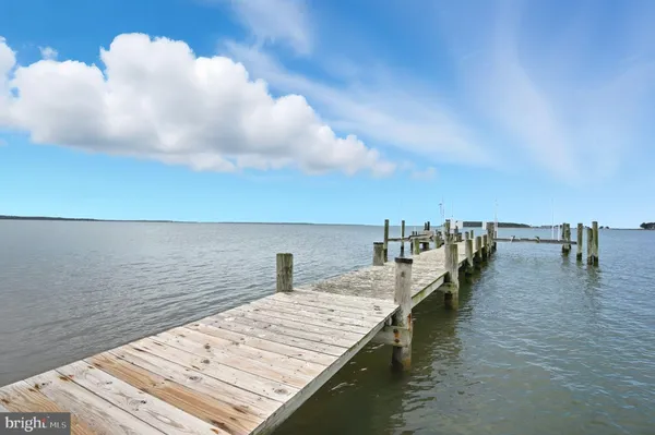 an aerial view of a house with a lake view