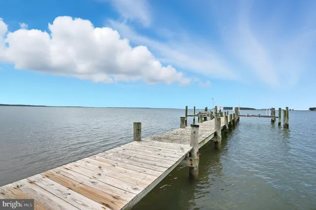 an aerial view of a house with a lake view