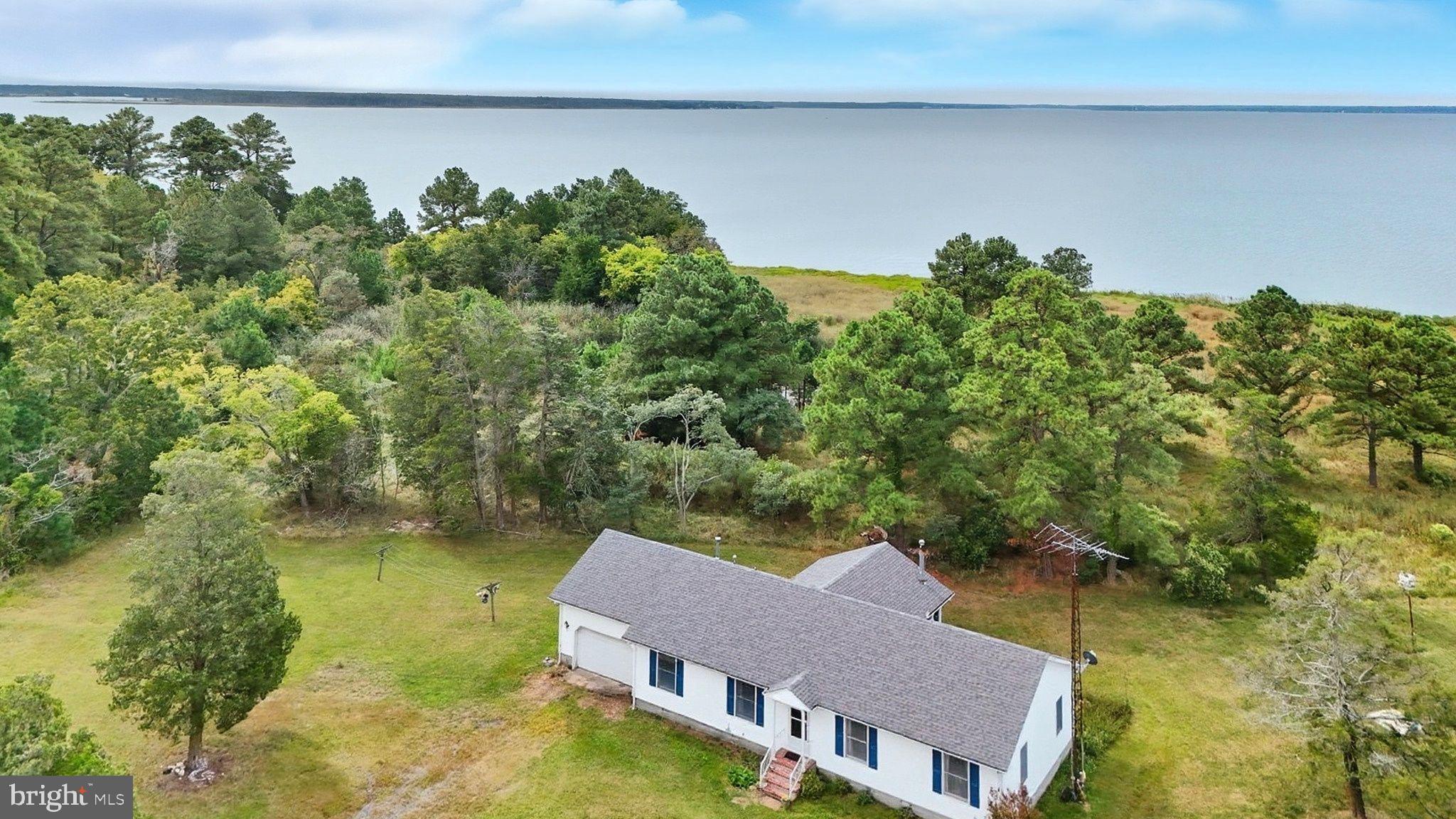 5304 Cassons Neck Road Cambridge, MD 21613 - Photo 31 of 46 an aerial view of a house with a lake view