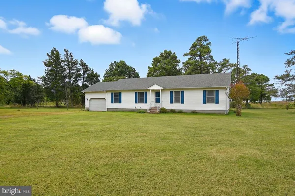 a view of a living room kitchen and a window