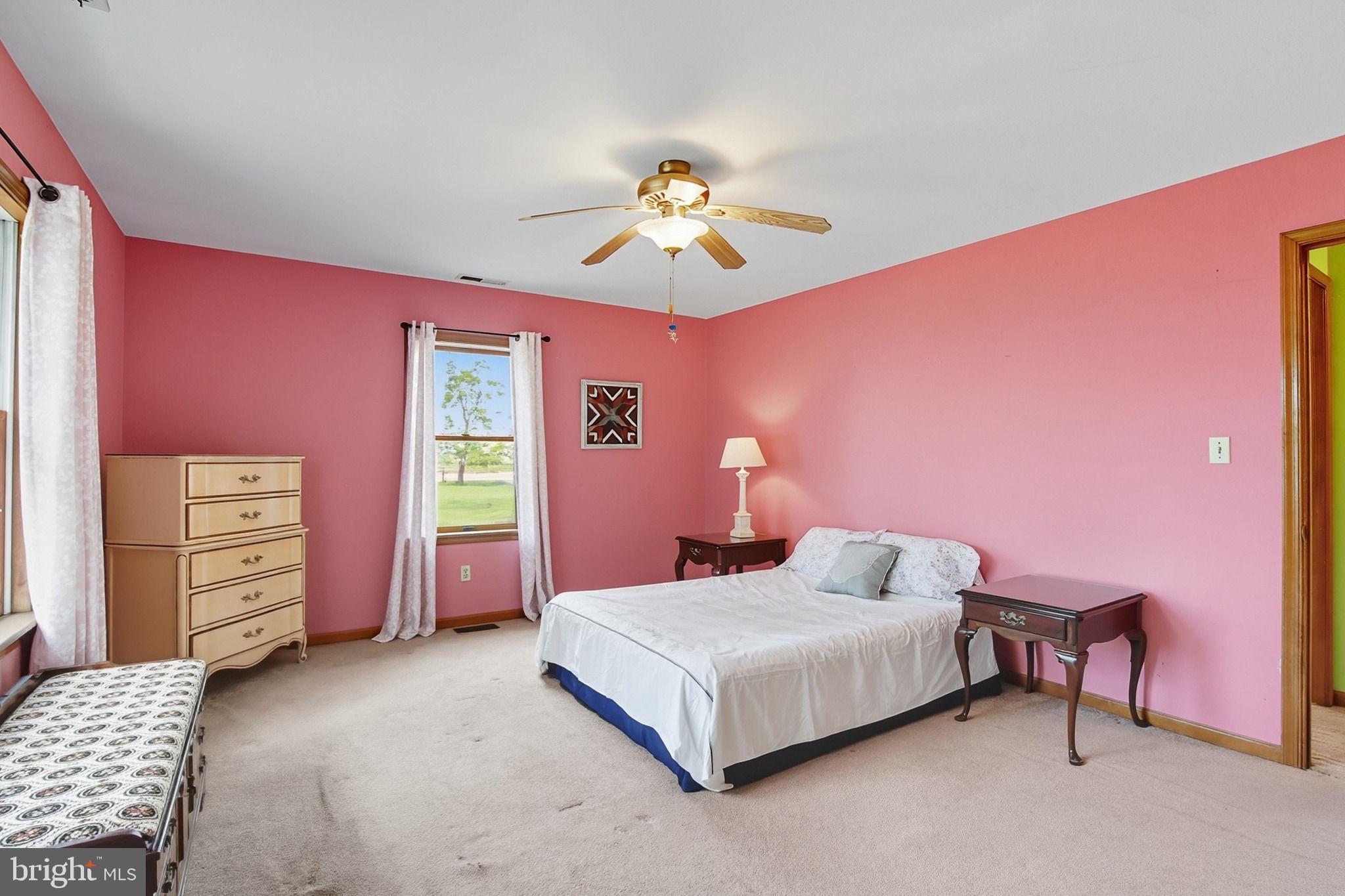 5304 Cassons Neck Road Cambridge, MD 21613 - Photo 43 of 46 a bedroom with a bed and a dresser