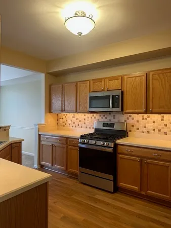 a kitchen with a stove and a sink
