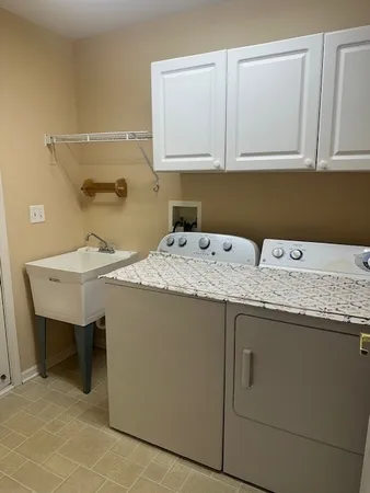 a utility room with a sink