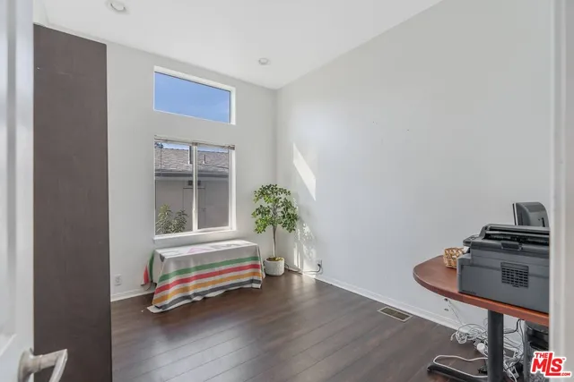 a room with furniture and wooden floor