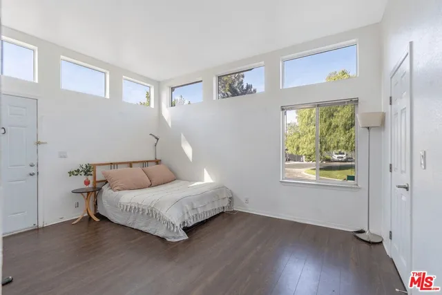 a room with a bed and a window