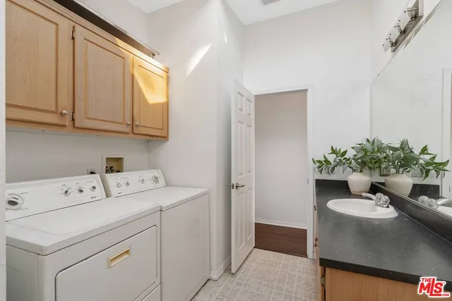 a view of storage and utility room with washer and dryer