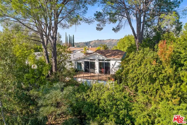 a aerial view of a house with a yard