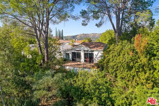 a aerial view of a house with a yard