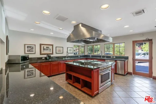 a kitchen with a stove and a refrigerator