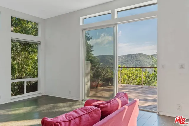 a living room with couch and a window
