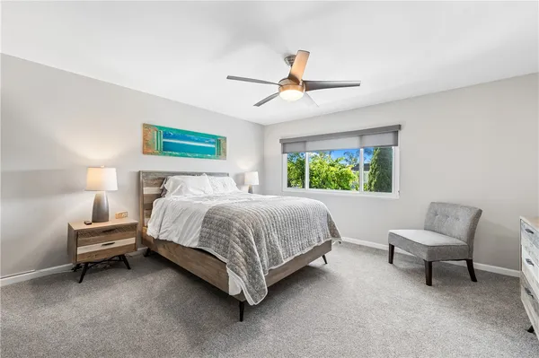 a bed room with a bed and a window
