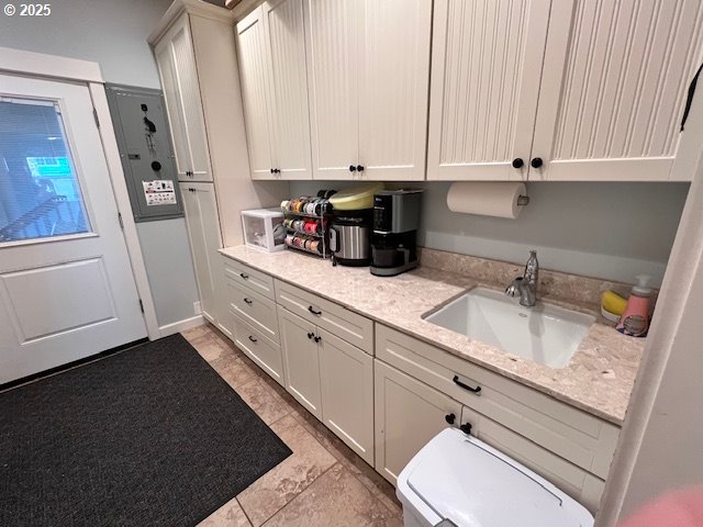 83178 South Pioneer Road Florence, OR 97439 - Photo 22 of 47 a kitchen with stainless steel appliances granite countertop a sink a stove and cabinets