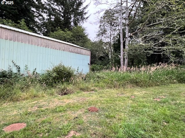 83178 South Pioneer Road Florence, OR 97439 - Photo 42 of 47 a backyard of a house with lots of green space