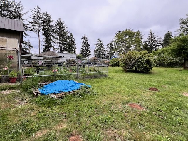 83178 South Pioneer Road Florence, OR 97439 - Photo 44 of 47 a view of a backyard with plants and a fountain