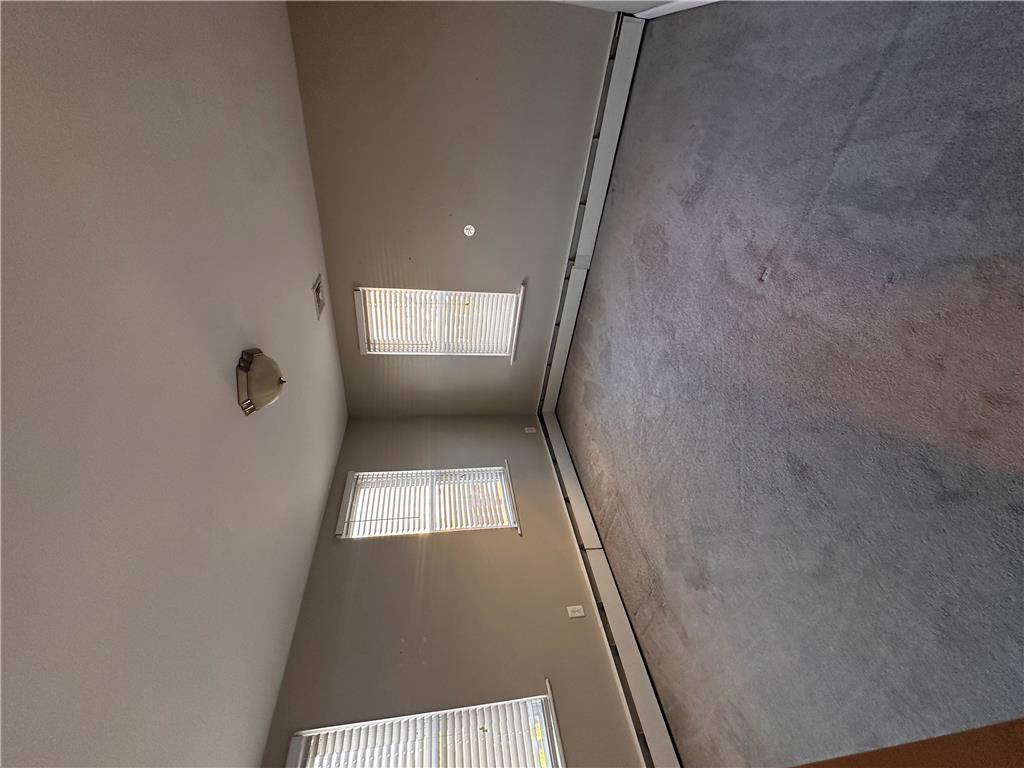 5128 3rd Street Whitehall, PA 18052 - Photo 20 of 26 Natural light streams through multiple windows in this well-lit room with soft carpeting.