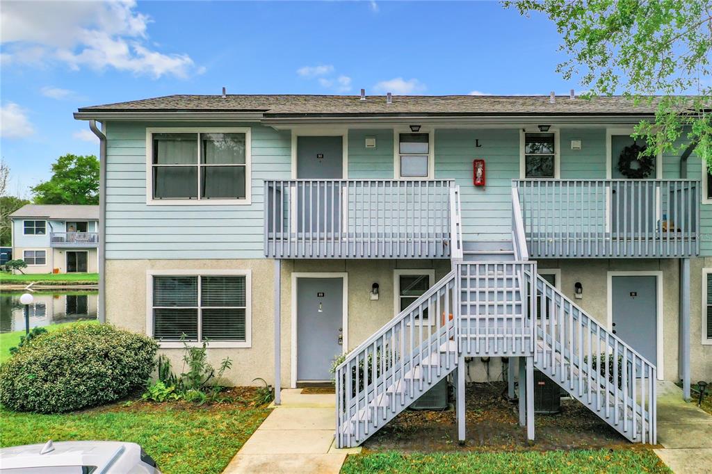 700 West Pope Road, Unit L89 St. Augustine, FL 32080 - Photo 1 of 1 a front view of a house with deck and a yard
