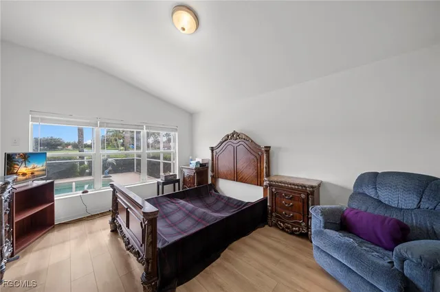 a living room with furniture rug and window