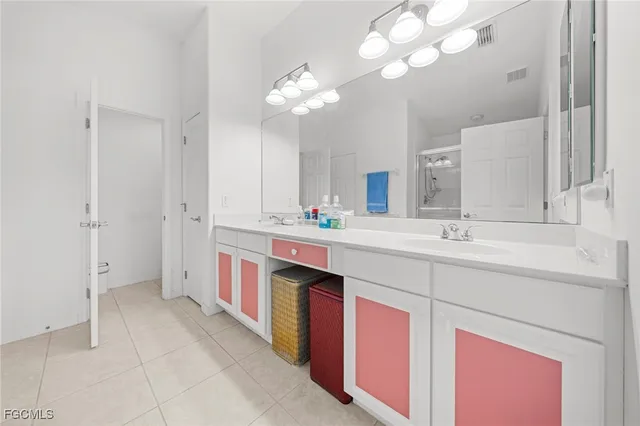 a spacious bathroom with a double vanity sink mirror and