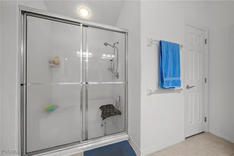 a bathroom with a shower and a sink