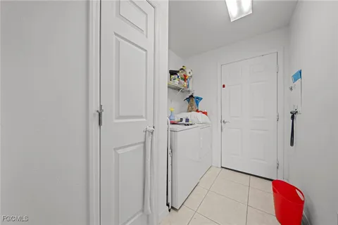 a bathroom with a shower and closet