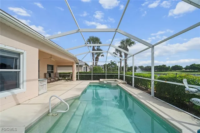 a view of a living room and patio