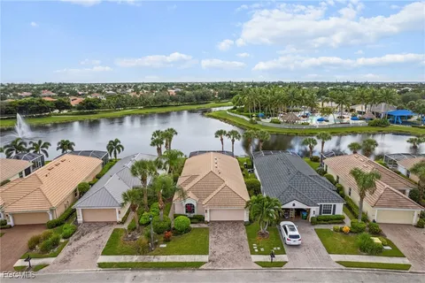 an aerial view of a house with a lake view