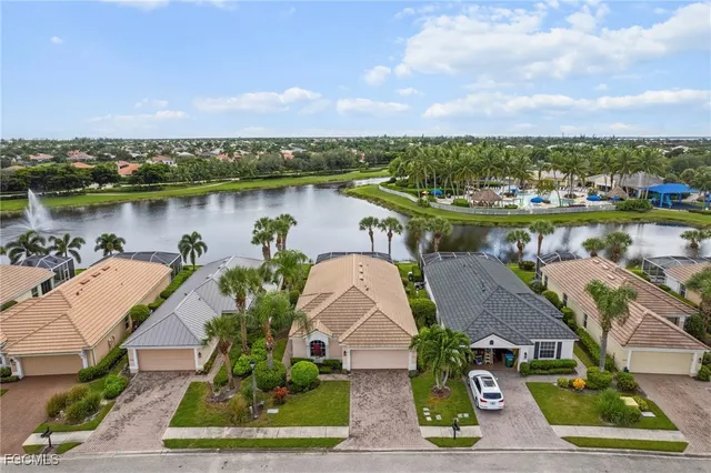 an aerial view of a house with a lake view