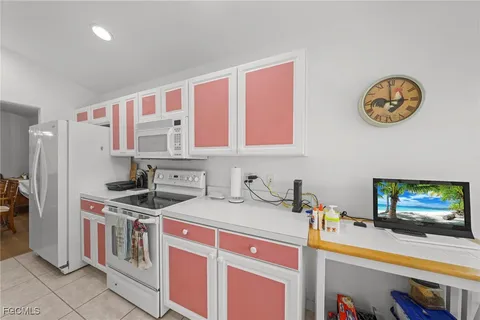 a kitchen that has a stove and a microwave