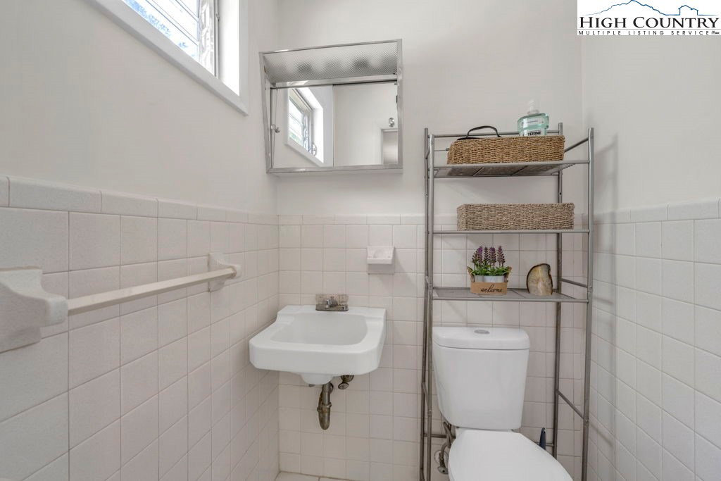 156 Olancha Avenue Boone, NC 28607 - Photo 14 of 23 a bathroom with a toilet sink and mirror