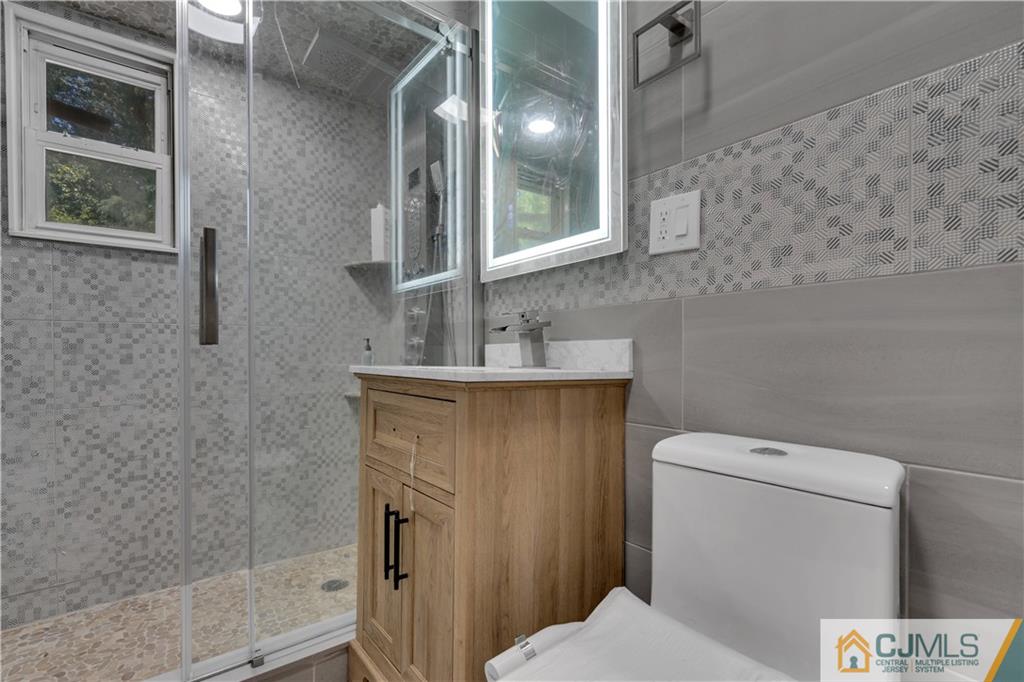 16 Channing Road East Brunswick, NJ 08816 - Photo 13 of 36 a bathroom with a toilet and a sink