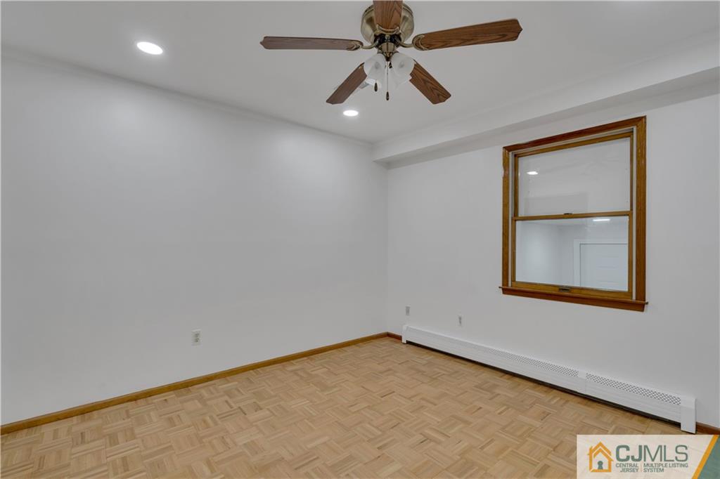 16 Channing Road East Brunswick, NJ 08816 - Photo 14 of 36 an empty room with a window and a ceiling fan