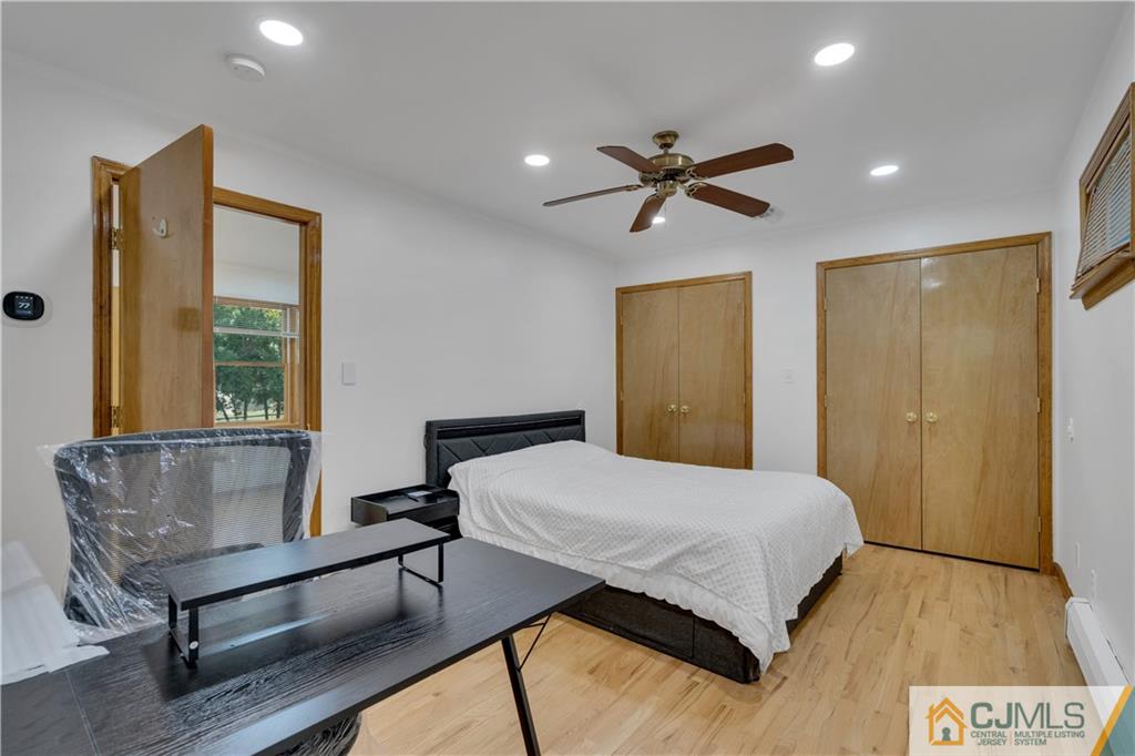 16 Channing Road East Brunswick, NJ 08816 - Photo 18 of 36 a bedroom with a bed and a dresser