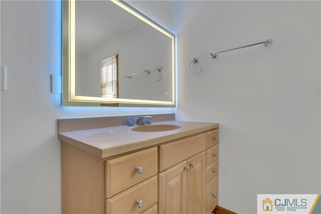 16 Channing Road East Brunswick, NJ 08816 - Photo 20 of 36 a bathroom with a sink and a mirror