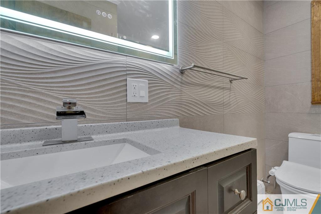 16 Channing Road East Brunswick, NJ 08816 - Photo 24 of 36 a bathroom with a sink and a toilet