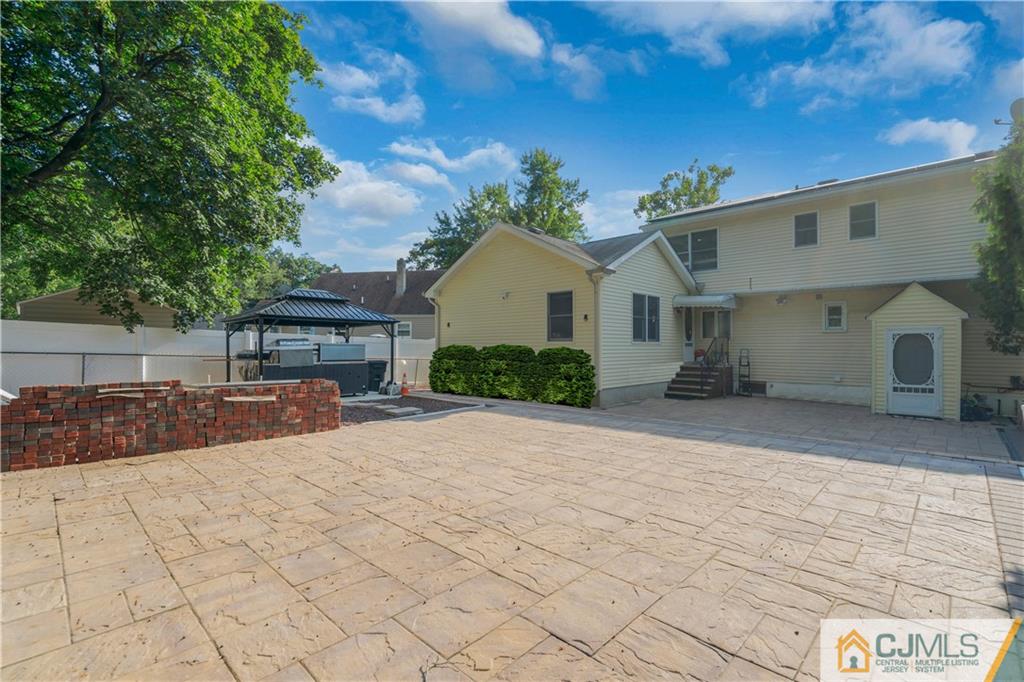 16 Channing Road East Brunswick, NJ 08816 - Photo 30 of 36 a front view of a house with a yard and garage