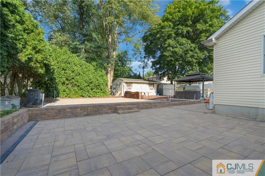 16 Channing Road East Brunswick, NJ 08816 - Photo 32 of 36 a view of a house with a yard and garage