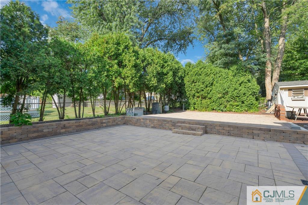 16 Channing Road East Brunswick, NJ 08816 - Photo 33 of 36 a view of a yard and a house